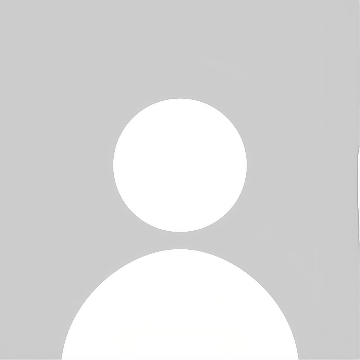 Generic white silhouette of a person's head and shoulders on a light gray background.